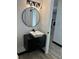 Modern bathroom with unique vanity, sink, mirror, and stylish lighting at 4756 Manly Ct, Stone Mountain, GA 30088