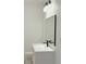 Bathroom vanity with a modern mirror and lighting fixture at 4756 Manly Ct, Stone Mountain, GA 30088