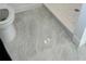 Bathroom featuring gray tile floors and toilet at 4756 Manly Ct, Stone Mountain, GA 30088