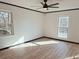 A clean, bright bedroom featuring new flooring, fresh paint, and natural lighting at 4756 Manly Ct, Stone Mountain, GA 30088
