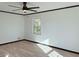 A clean, bright bedroom featuring new flooring, fresh paint, and natural lighting at 4756 Manly Ct, Stone Mountain, GA 30088