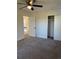 Bedroom featuring neutral walls, carpet, ceiling fan, closet and view to hallway at 4756 Manly Ct, Stone Mountain, GA 30088