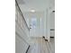 Bright foyer with stylish front door and staircase, showcasing modern flooring and fresh paint at 4756 Manly Ct, Stone Mountain, GA 30088