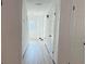 Bright hallway leading to the front door featuring modern flooring and fresh paint at 4756 Manly Ct, Stone Mountain, GA 30088