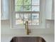 Close up view of kitchen sink with window looking out to the yard at 4756 Manly Ct, Stone Mountain, GA 30088