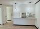 Bright kitchen with modern pendant lights and white countertops at 4756 Manly Ct, Stone Mountain, GA 30088