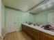 Bathroom with wood cabinets, long vanity, and framed mirror at 2000 Stone Mountain Lithonia Rd, Lithonia, GA 30058