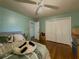 Inviting bedroom with hardwood floors and access to a spacious closet at 2000 Stone Mountain Lithonia Rd, Lithonia, GA 30058