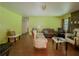 Spacious living room with wood floors, fireplace, and cozy seating at 2000 Stone Mountain Lithonia Rd, Lithonia, GA 30058