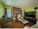 Spacious living room with fireplace and a large television at 2000 Stone Mountain Lithonia Rd, Lithonia, GA 30058