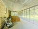 Enclosed porch offering space for relaxation and outdoor enjoyment at 2000 Stone Mountain Lithonia Rd, Lithonia, GA 30058