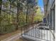 View of porch showing access to wooded view of back yard area with black metal fence at 3149 Buford Hwy # 3, Brookhaven, GA 30329