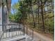 View of porch showing access to wooded view of back yard area with black metal fence at 3149 Buford Hwy # 3, Brookhaven, GA 30329