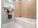 A well-lit bathroom showcases a window, tile accents, and a tub at 3149 Buford Hwy # 3, Brookhaven, GA 30329