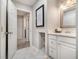 A clean bathroom features white marble tile, a sink, and a vanity at 3149 Buford Hwy # 3, Brookhaven, GA 30329