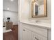 A well-lit bathroom featuring a framed mirror, undermount sink, and white cabinet at 3149 Buford Hwy # 3, Brookhaven, GA 30329