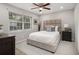 A staged bedroom is complete with a bed, matching furniture, and a window at 3149 Buford Hwy # 3, Brookhaven, GA 30329