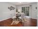 Dining area with hardwood floors, a round table with four chairs, and sliding glass doors at 3149 Buford Hwy # 3, Brookhaven, GA 30329