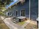 Exterior of building showing multiple back doors and steps to ground level with black metal railing at 3149 Buford Hwy # 3, Brookhaven, GA 30329