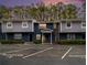 Two-story condo building with reserved parking spaces and a combination brick and siding facade at 3149 Buford Hwy # 3, Brookhaven, GA 30329