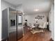 Open-concept living room with hardwood floors, modern decor, and access to the dining area at 3149 Buford Hwy # 3, Brookhaven, GA 30329