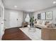 Bright living room featuring hardwood floors, a modern sofa, and a decorative coffee table at 3149 Buford Hwy # 3, Brookhaven, GA 30329