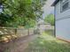 A spacious, fenced-in backyard with green grass, ideal for outdoor activities and privacy at 377 Wyndham Way, Atlanta, GA 30315