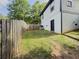 The property features a grassy, fenced-in backyard with an access door on the side of the home at 377 Wyndham Way, Atlanta, GA 30315