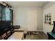 Guest bedroom featuring a TV, seat, and poster on the wall at 377 Wyndham Way, Atlanta, GA 30315