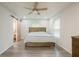 Bedroom features a ceiling fan, barn door access to the bath, and lots of natural light at 377 Wyndham Way, Atlanta, GA 30315