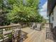 Back deck featuring multiple chairs and views of the surrounding trees at 377 Wyndham Way, Atlanta, GA 30315