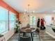 Cozy dining area featuring modern lighting, a round table, and natural light from nearby windows at 377 Wyndham Way, Atlanta, GA 30315