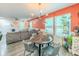 Bright dining area open to living space with modern lighting fixture at 377 Wyndham Way, Atlanta, GA 30315
