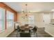 Charming dining area with modern lighting and a view into the kitchen and living spaces at 377 Wyndham Way, Atlanta, GA 30315