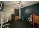 Home exercise room with rubber flooring, fan, and weightlifting equipment at 377 Wyndham Way, Atlanta, GA 30315