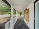 Inviting front porch featuring classic white railings and a dark-stained wooden floor at 377 Wyndham Way, Atlanta, GA 30315