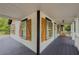 Charming covered front porch with rocking chairs and a stylish blue door at 377 Wyndham Way, Atlanta, GA 30315