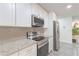 Modern kitchen with stainless steel appliances, granite countertops, and contemporary design at 377 Wyndham Way, Atlanta, GA 30315