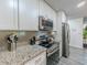 Granite countertops and stainless appliances in a modern kitchen at 377 Wyndham Way, Atlanta, GA 30315