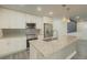 Modern kitchen featuring stainless steel appliances, granite countertops, and a stylish island at 377 Wyndham Way, Atlanta, GA 30315
