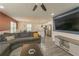 Open-concept living room with modern furnishings, a large TV, and hardwood floors at 377 Wyndham Way, Atlanta, GA 30315
