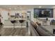 Open floor plan featuring a modern kitchen with breakfast bar seating and a cozy living area with entertainment center at 377 Wyndham Way, Atlanta, GA 30315