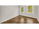 This bedroom has two windows, wood floors, and is ready for staging at 53 Springside Se Dr, Atlanta, GA 30354