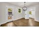 Cozy dining room with modern chandelier and backyard access at 53 Springside Se Dr, Atlanta, GA 30354
