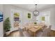 Cozy dining room with modern chandelier, neutral paint, and backyard access at 53 Springside Se Dr, Atlanta, GA 30354