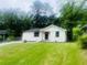 Charming renovated single-story home with a well-manicured front lawn and black trimmed windows at 53 Springside Se Dr, Atlanta, GA 30354
