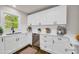 Modern kitchen with stainless steel appliances, white cabinets, and sleek countertops at 53 Springside Se Dr, Atlanta, GA 30354