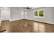 Bright, open-concept living room with hardwood floors and neutral paint at 53 Springside Se Dr, Atlanta, GA 30354