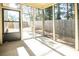 Relaxing screened back porch with concrete flooring and outdoor views at 610 Sunflower Dr, Canton, GA 30114