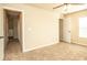 Spacious bedroom with beige walls, ceiling fan, and connecting doors to other rooms in the home at 610 Sunflower Dr, Canton, GA 30114